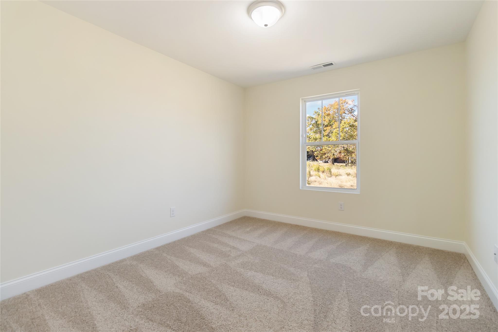 1012 Heath Helms Road Monroe, NC 28110 - Photo 23 of 48 an empty room with windows