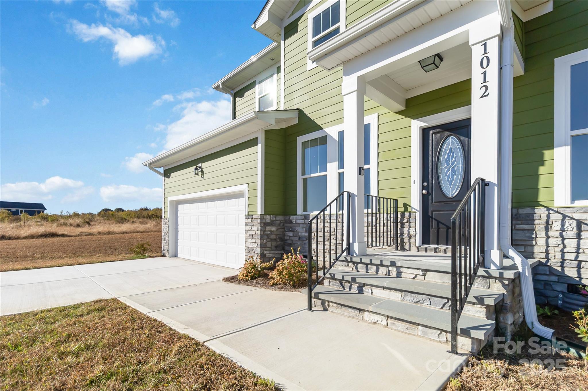 1012 Heath Helms Road Monroe, NC 28110 - Photo 3 of 48 a front view of a house having yard