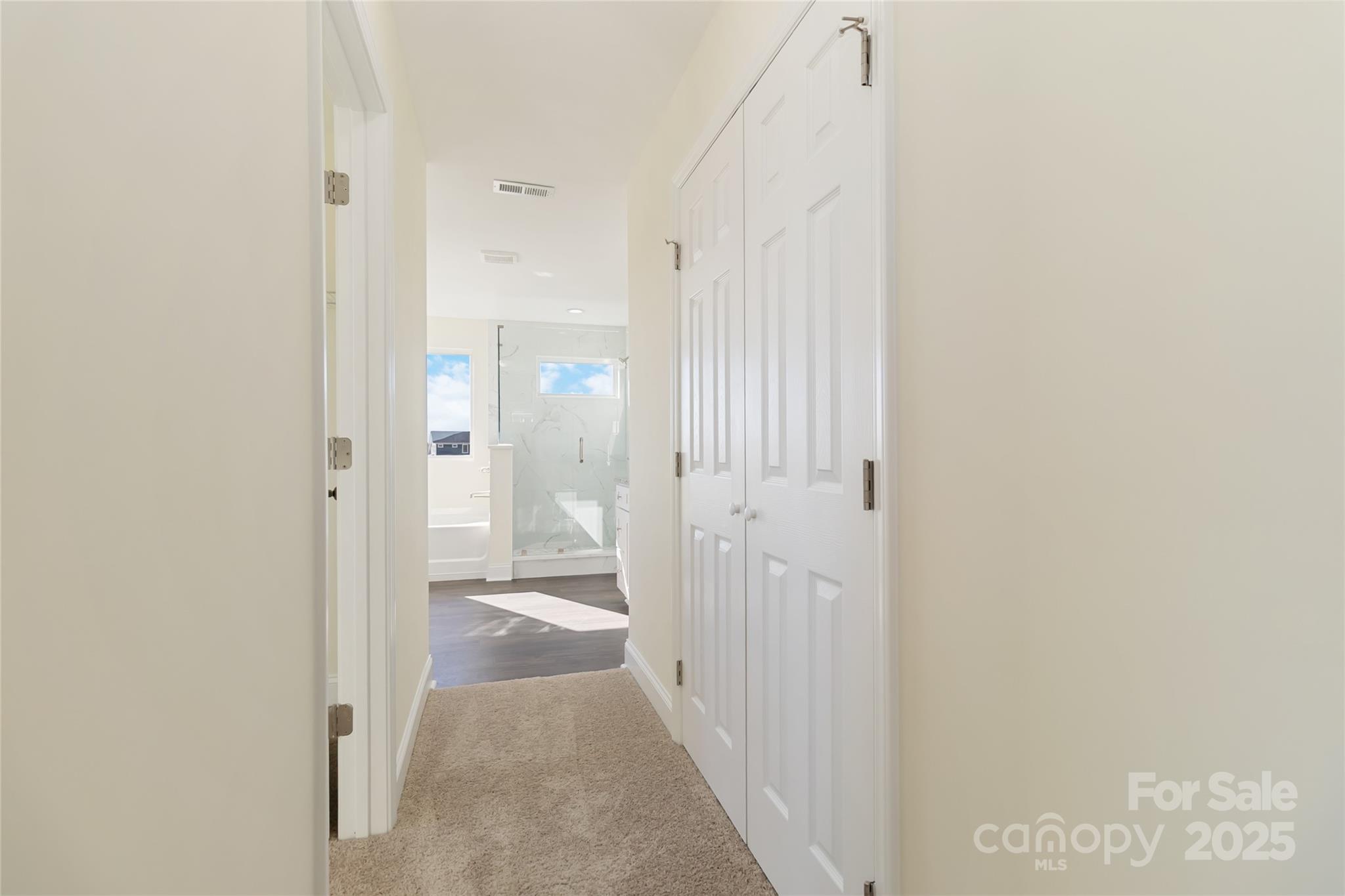 1012 Heath Helms Road Monroe, NC 28110 - Photo 32 of 48 a view of a bathroom from a hallway