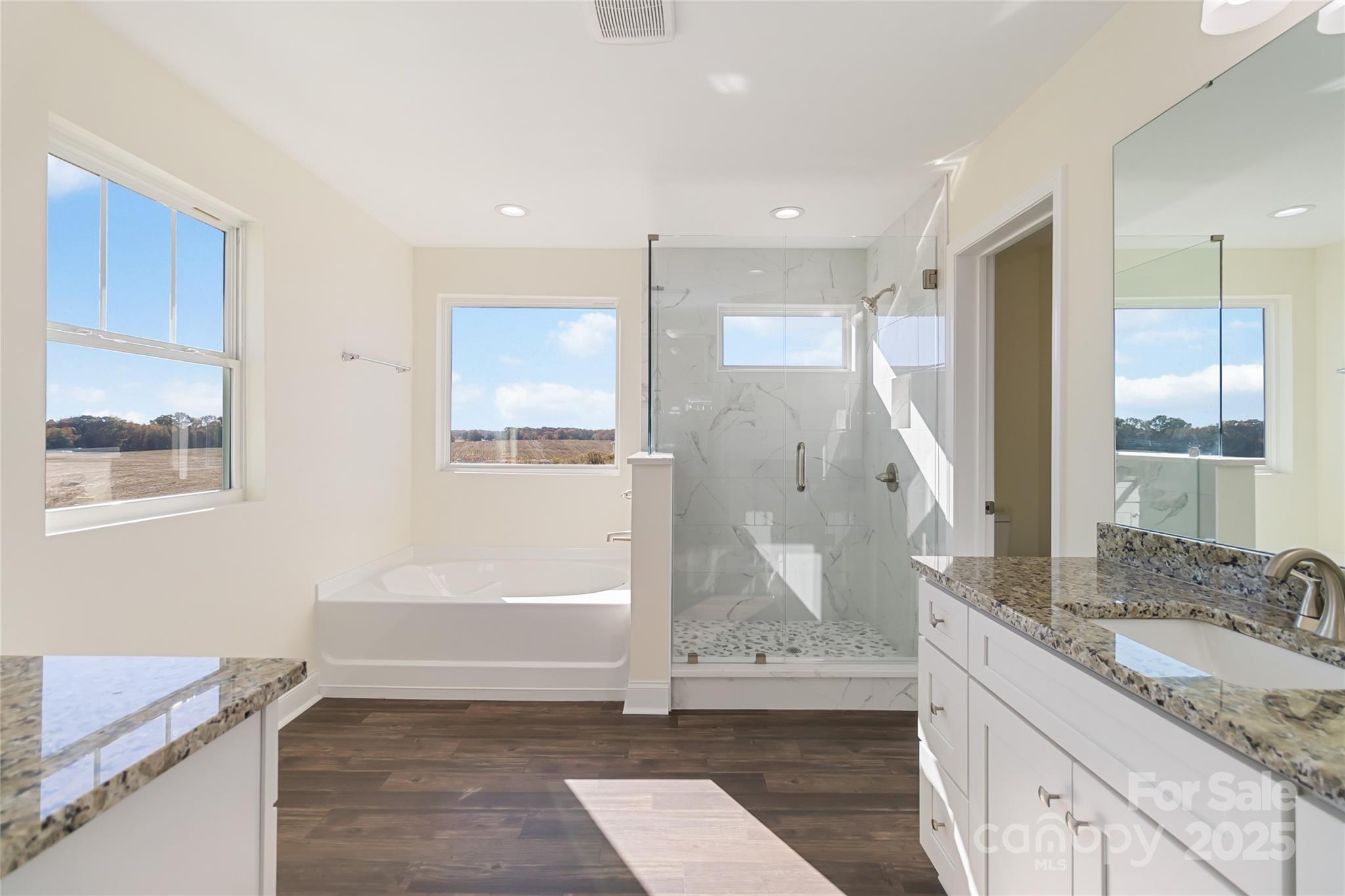 1012 Heath Helms Road Monroe, NC 28110 - Photo 34 of 48 a bathroom with a granite countertop sink and a mirror