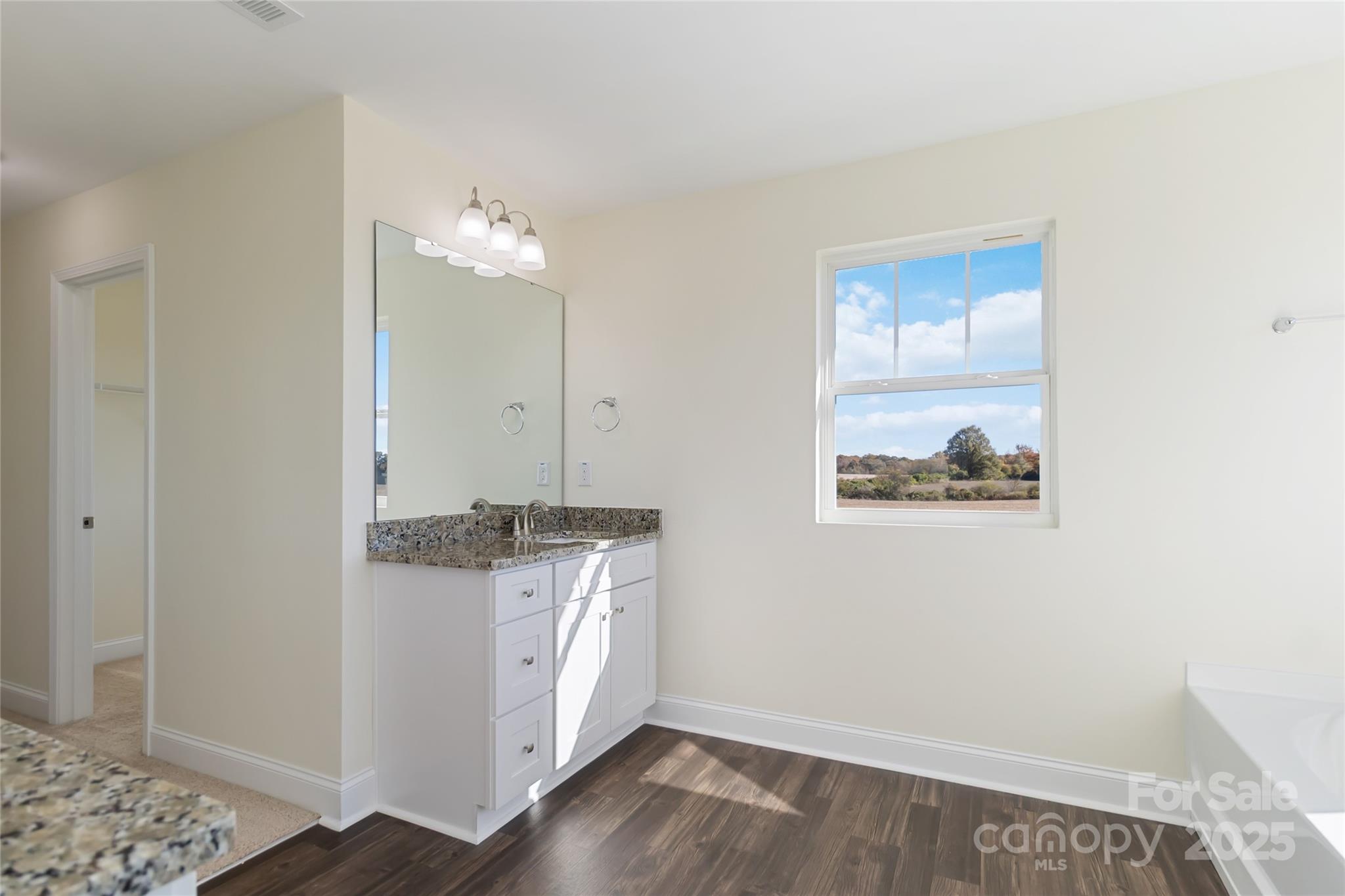 1012 Heath Helms Road Monroe, NC 28110 - Photo 36 of 48 a view of a kitchen with wooden floor and cabinets
