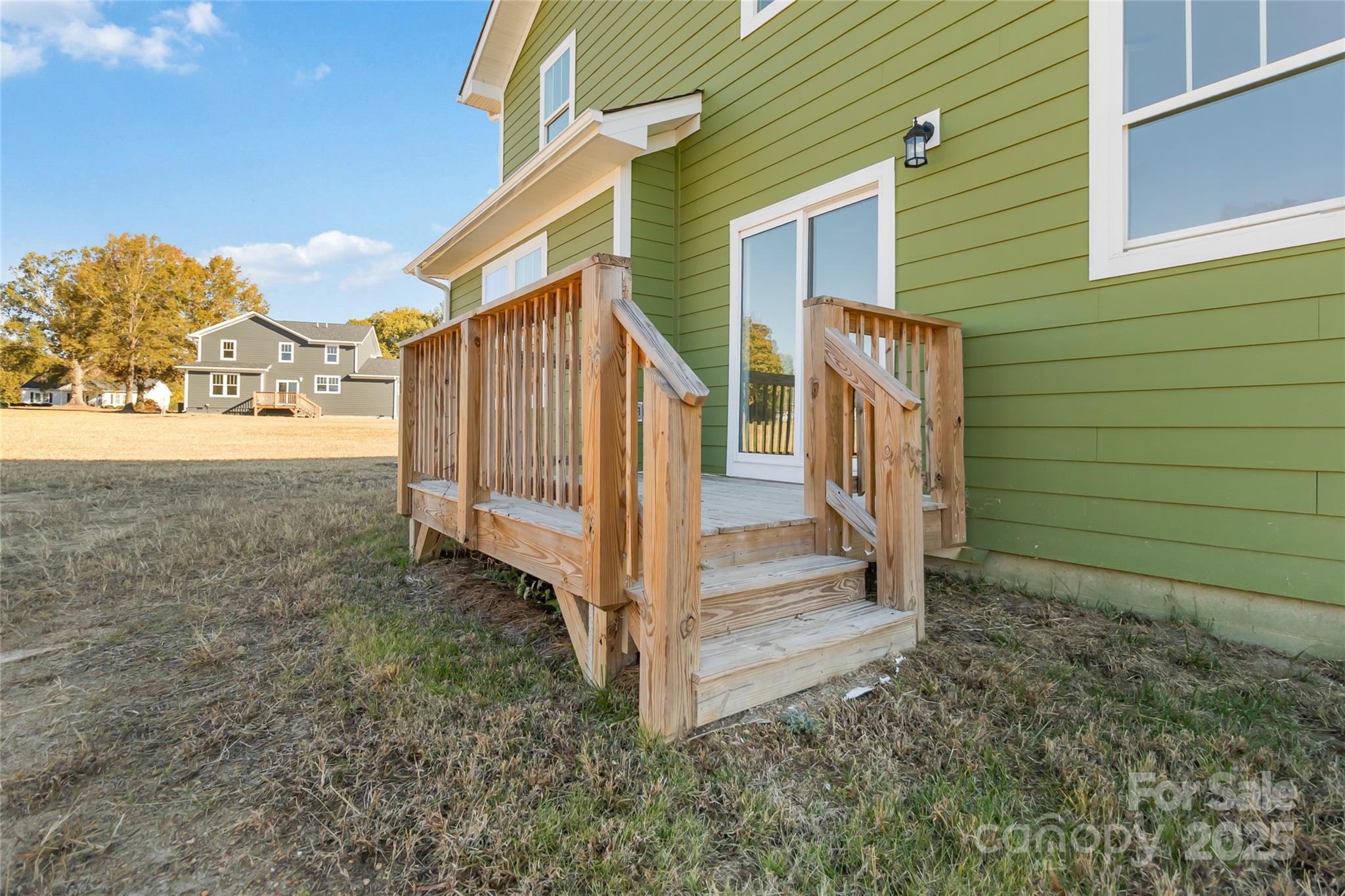 1012 Heath Helms Road Monroe, NC 28110 - Photo 40 of 48 a view of a house with backyard and wooden fence