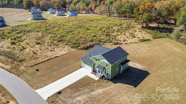 a bench sitting in the middle of a yard