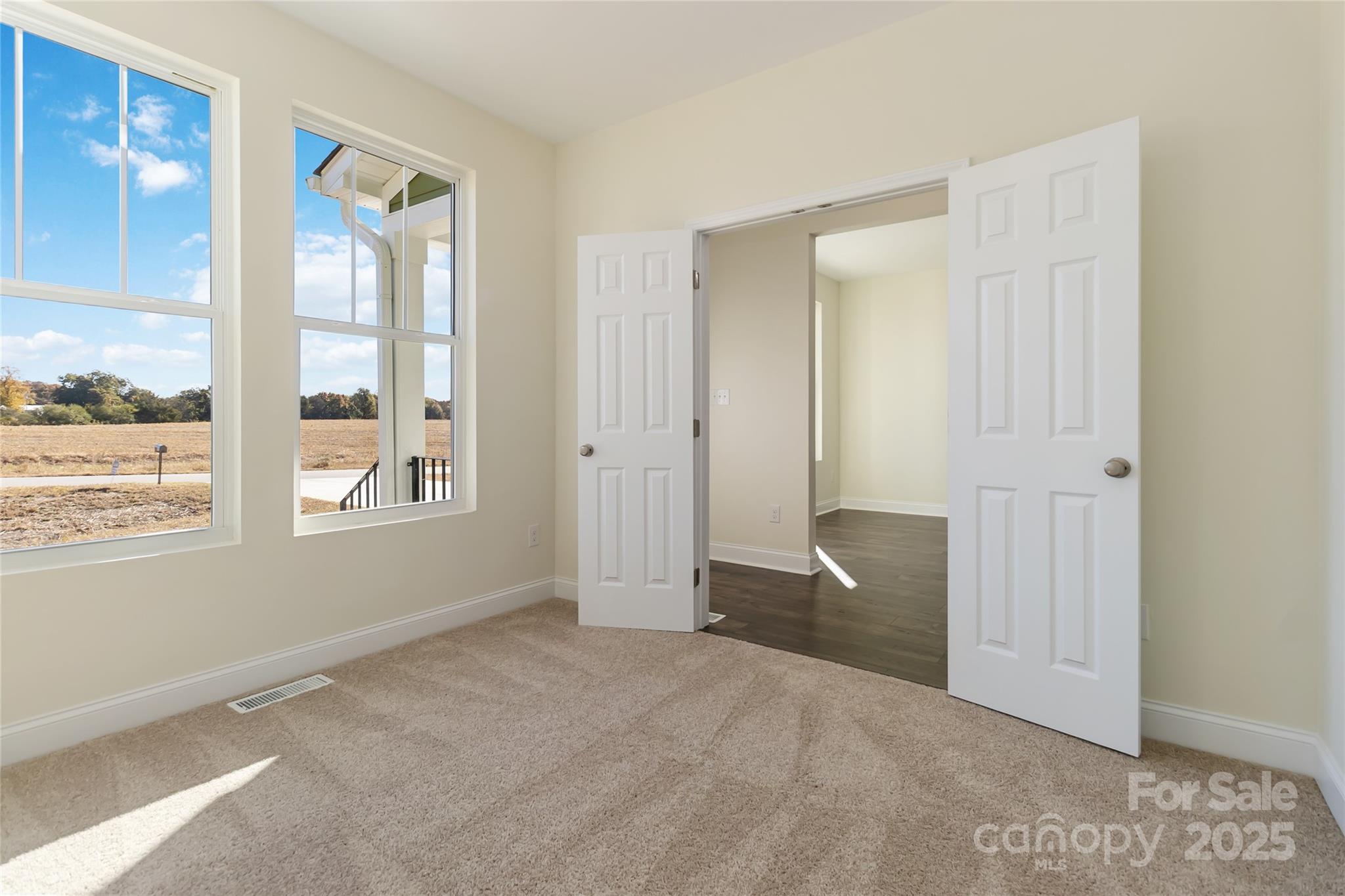 1012 Heath Helms Road Monroe, NC 28110 - Photo 7 of 48 a view of an empty room with a window