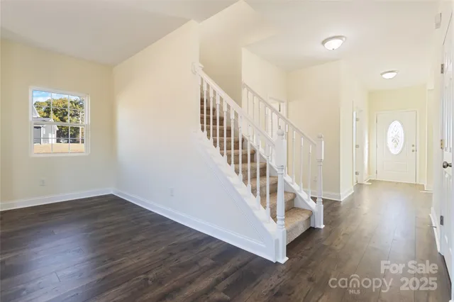 a view of an entryway with wooden floor