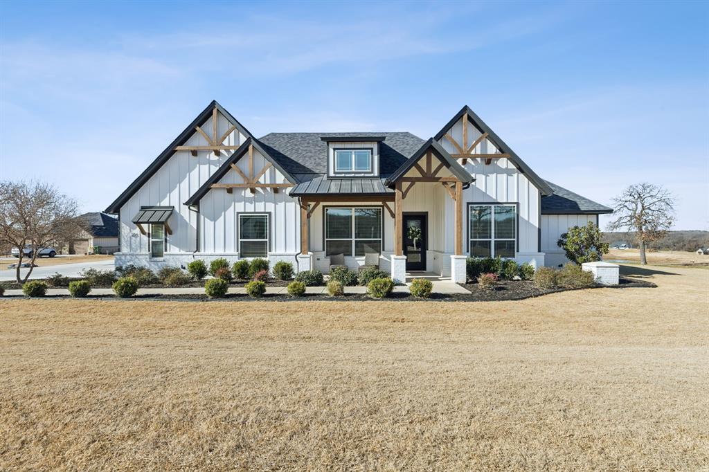 125 San Miguel Drive Decatur, TX 76234 - Photo 1 of 36 a front view of a house with yard and porch