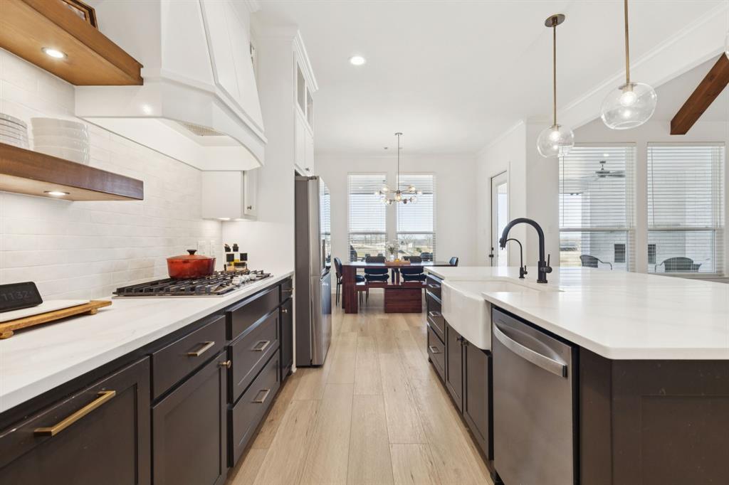 125 San Miguel Drive Decatur, TX 76234 - Photo 13 of 36 a kitchen with sink stove and cabinets