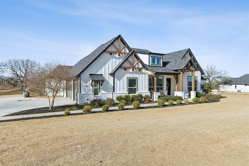 125 San Miguel Drive Decatur, TX 76234 - Photo 2 of 36 a front view of a house with a yard