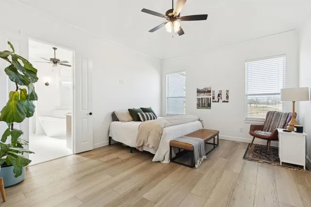 a bedroom with a bed and a chair