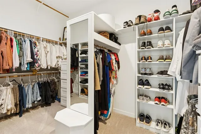 a kitchen with granite countertop a refrigerator and a sink