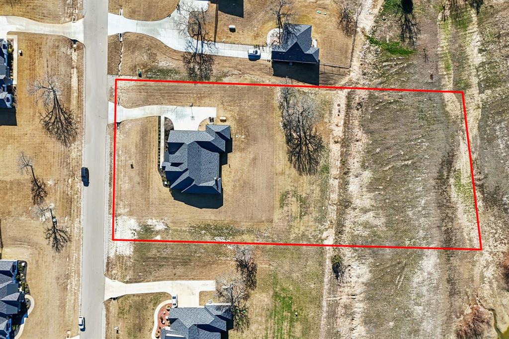 125 San Miguel Drive Decatur, TX 76234 - Photo 36 of 36 a bathroom with a shower and a sink