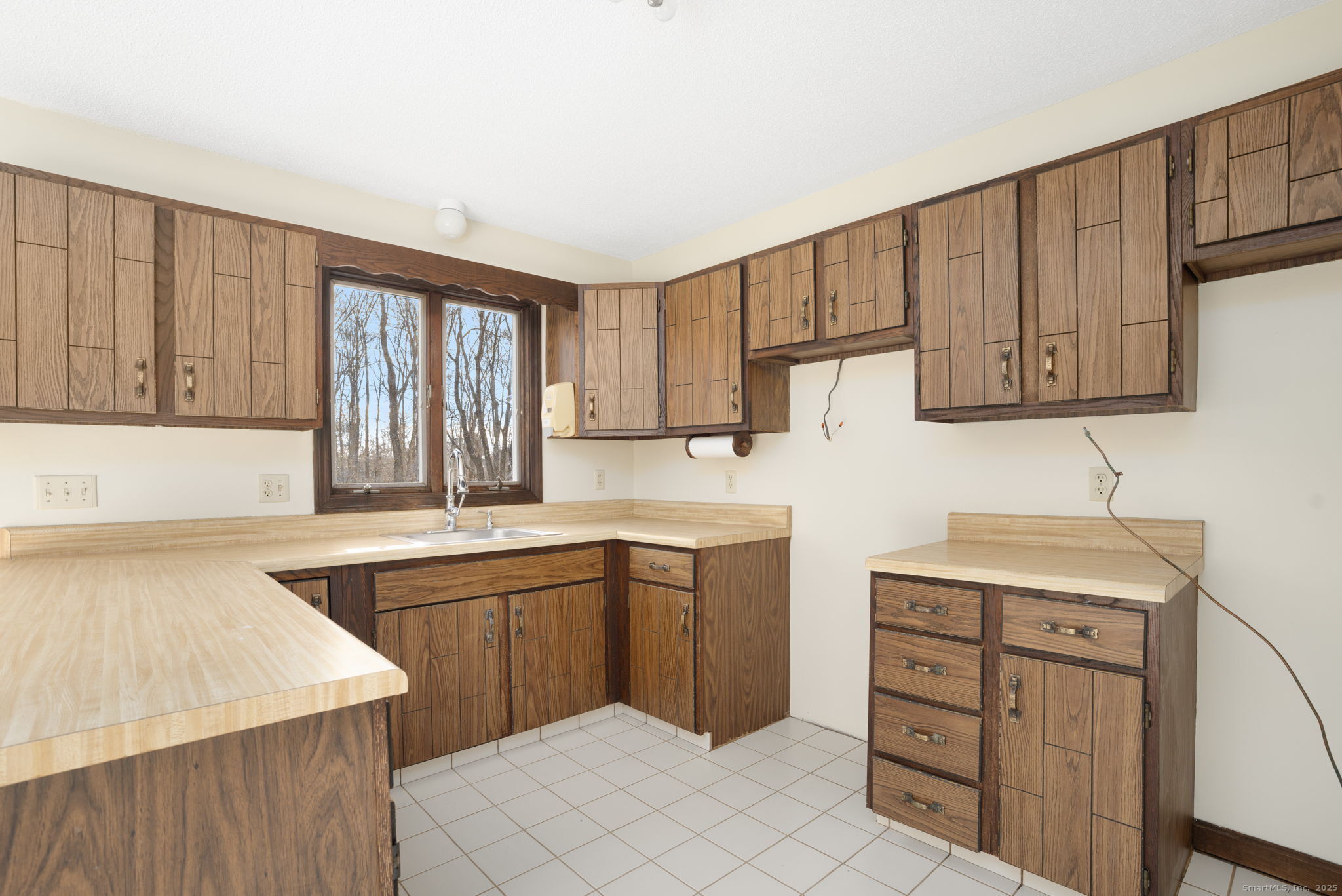137 Drain Street Hampton, CT 06247 - Photo 11 of 30 a kitchen with a sink stove and cabinets