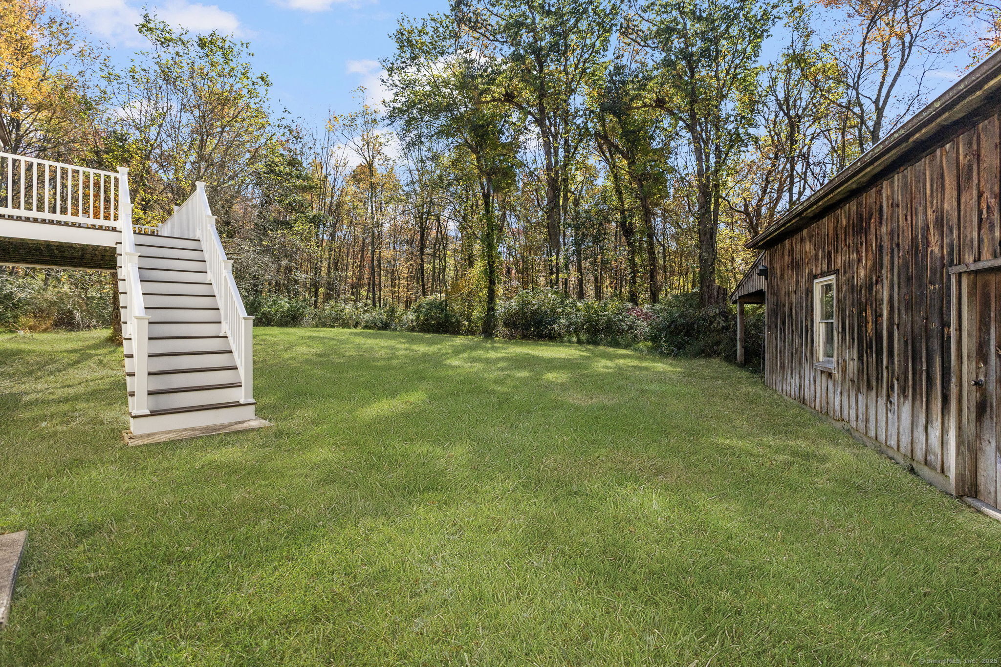 137 Drain Street Hampton, CT 06247 - Photo 22 of 30 a view of a backyard with wooden fence
