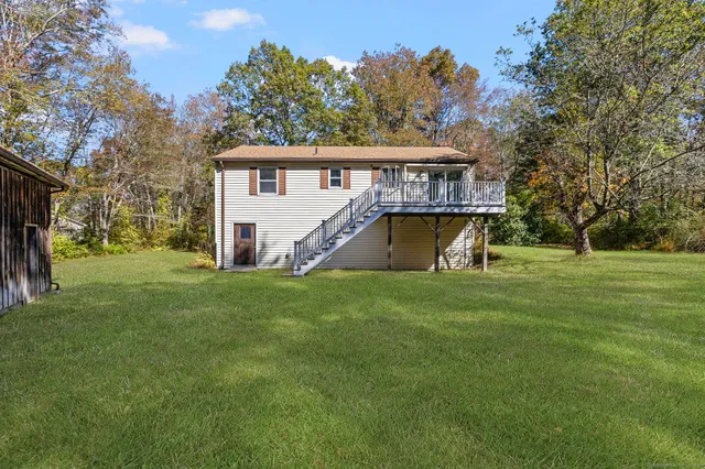 a tree in the middle of a yard