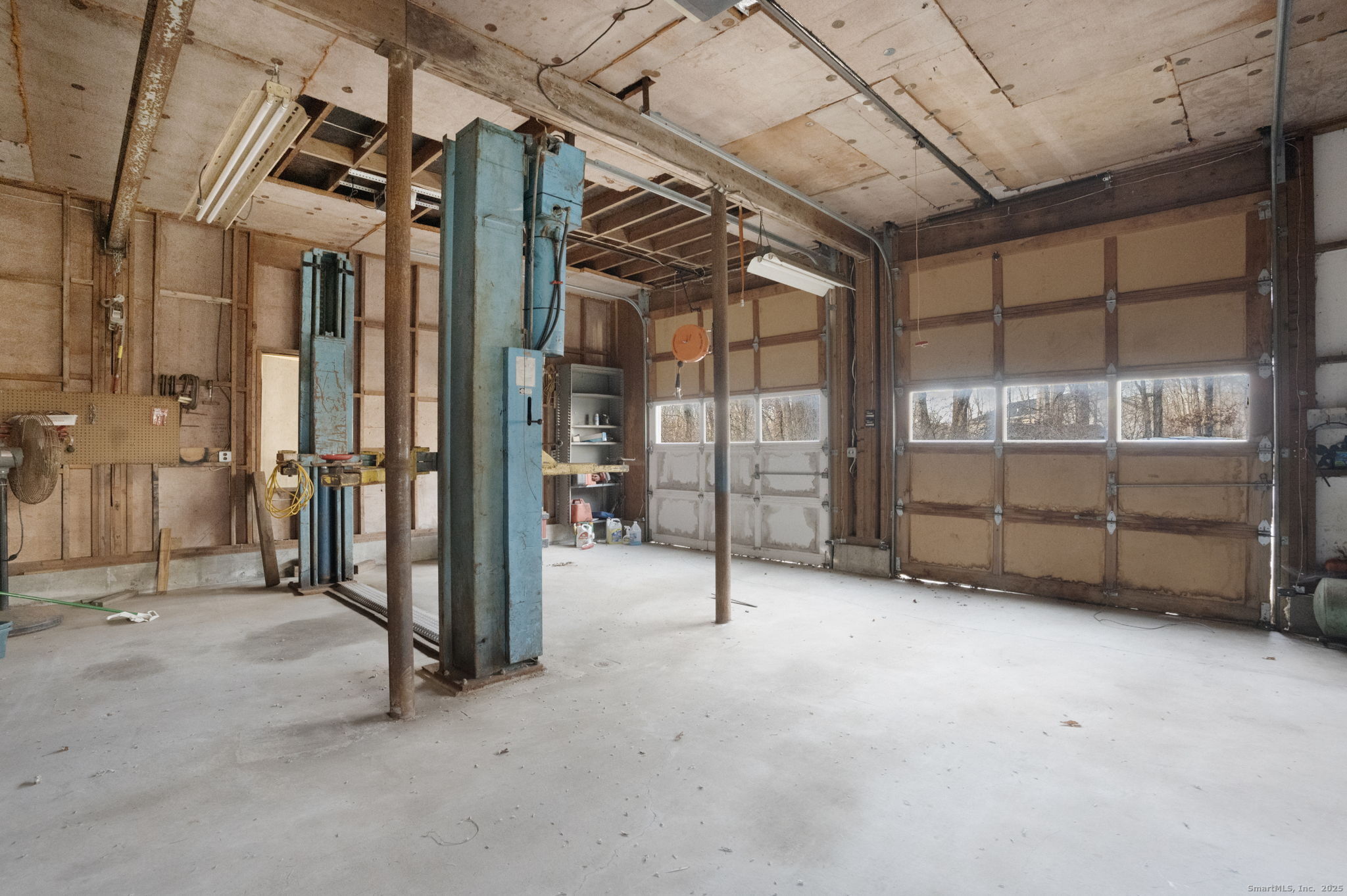 137 Drain Street Hampton, CT 06247 - Photo 3 of 30 a view of an empty room with racks on the wall
