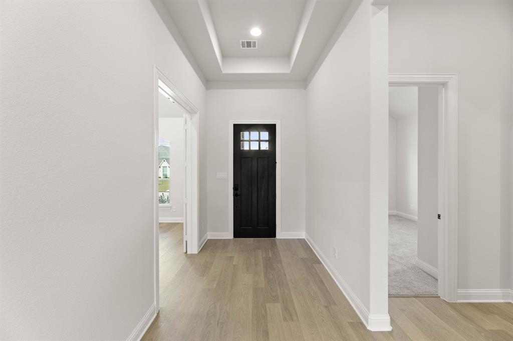 5210 Rowlan Row Midlothian, TX 76065 - Photo 10 of 40 a view of hallway with wooden floor