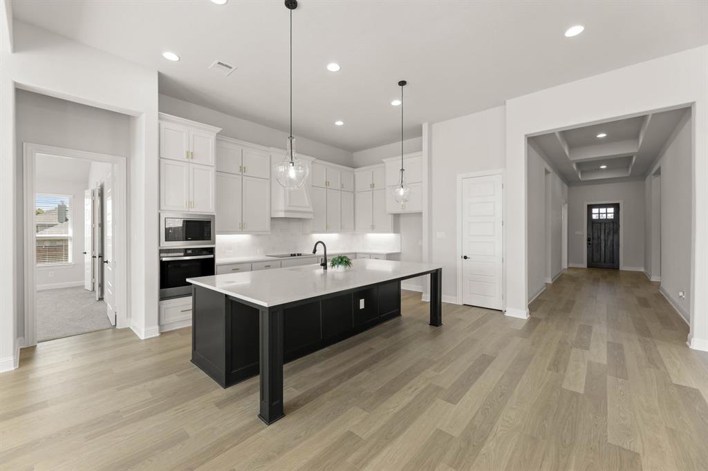 5210 Rowlan Row Midlothian, TX 76065 - Photo 15 of 40 a large kitchen with a lot of counter space