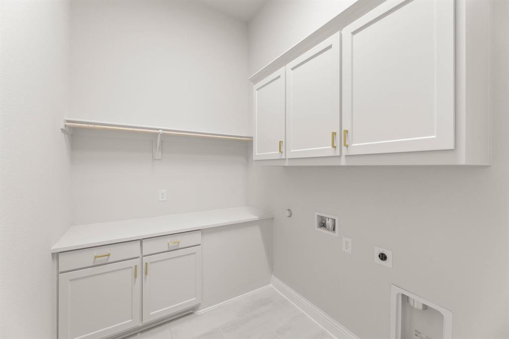 5210 Rowlan Row Midlothian, TX 76065 - Photo 21 of 40 a kitchen with white cabinets and white appliances