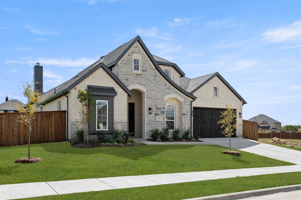 5210 Rowlan Row Midlothian, TX 76065 - Photo 3 of 40 a front view of a house with a yard