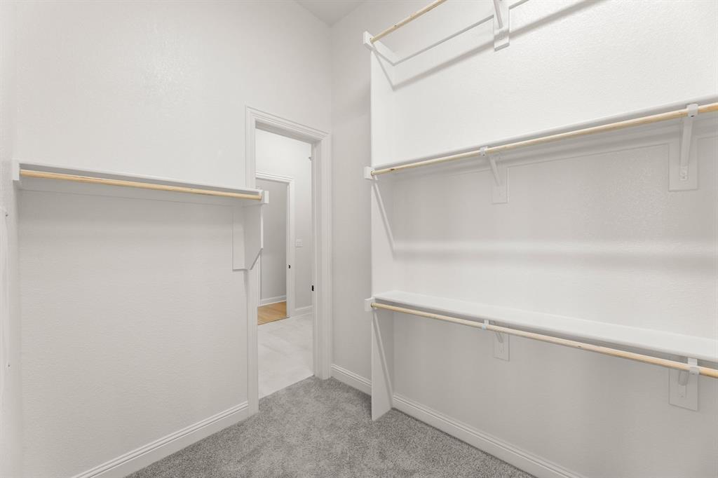 5210 Rowlan Row Midlothian, TX 76065 - Photo 37 of 40 a view of an empty walk in closet