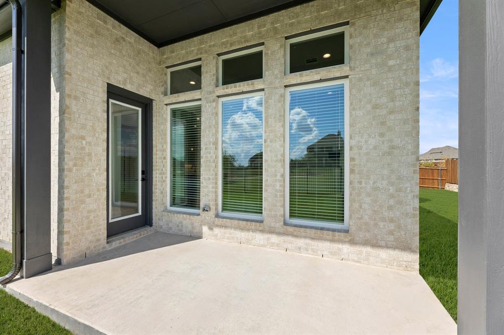 5210 Rowlan Row Midlothian, TX 76065 - Photo 9 of 40 a view of a brick house with a large window