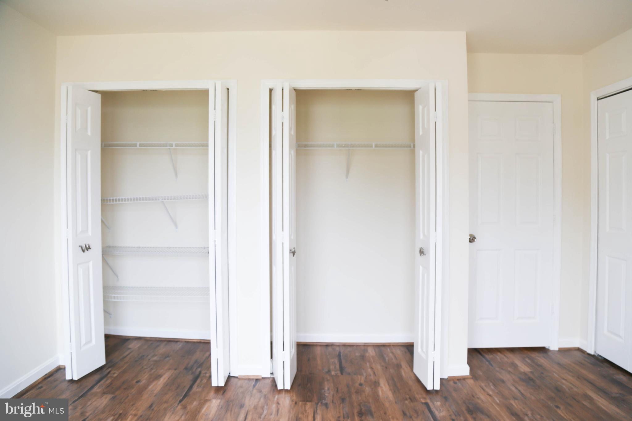8461 Tackhouse Loop Gainesville, VA 20155 - Photo 15 of 39 a view of an empty room with wooden floor