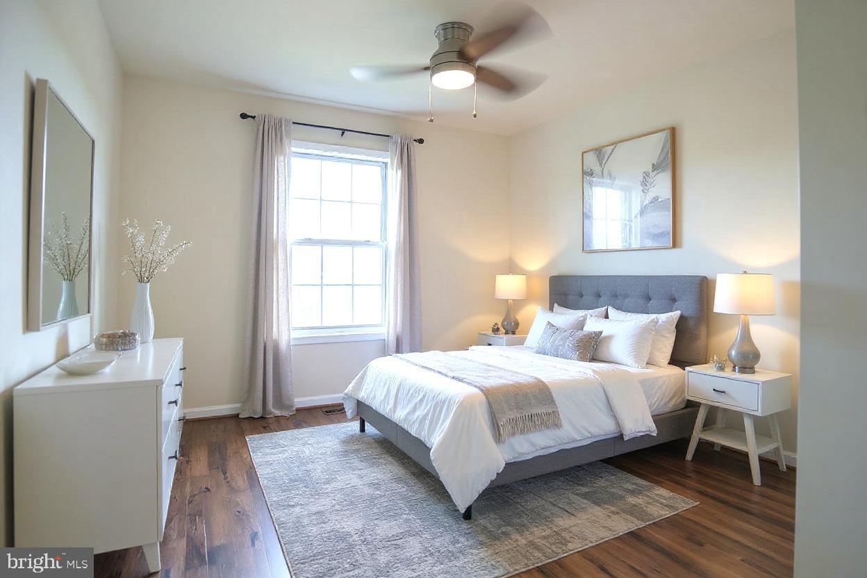 8461 Tackhouse Loop Gainesville, VA 20155 - Photo 22 of 39 a bedroom with a bed and a window