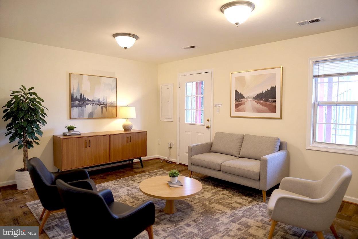 8461 Tackhouse Loop Gainesville, VA 20155 - Photo 30 of 39 a living room with furniture and a window