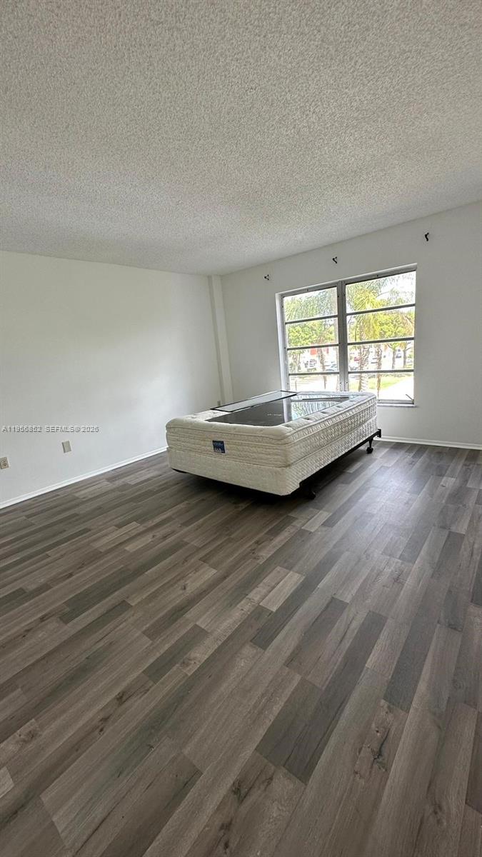4174 Inverrary Drive, Unit 311 Lauderhill, FL 33319 - Photo 18 of 29 a view of a room with wooden floor and window