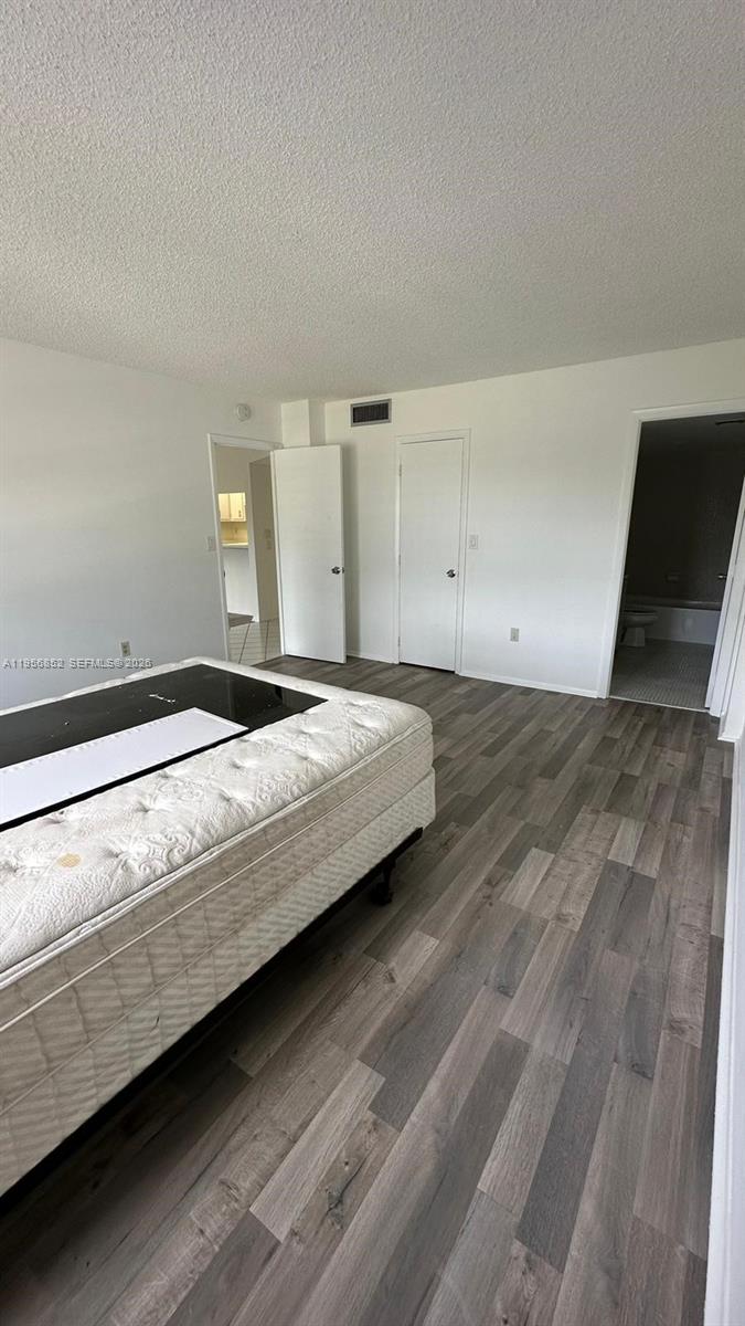 4174 Inverrary Drive, Unit 311 Lauderhill, FL 33319 - Photo 19 of 29 a bedroom with a bed and a window