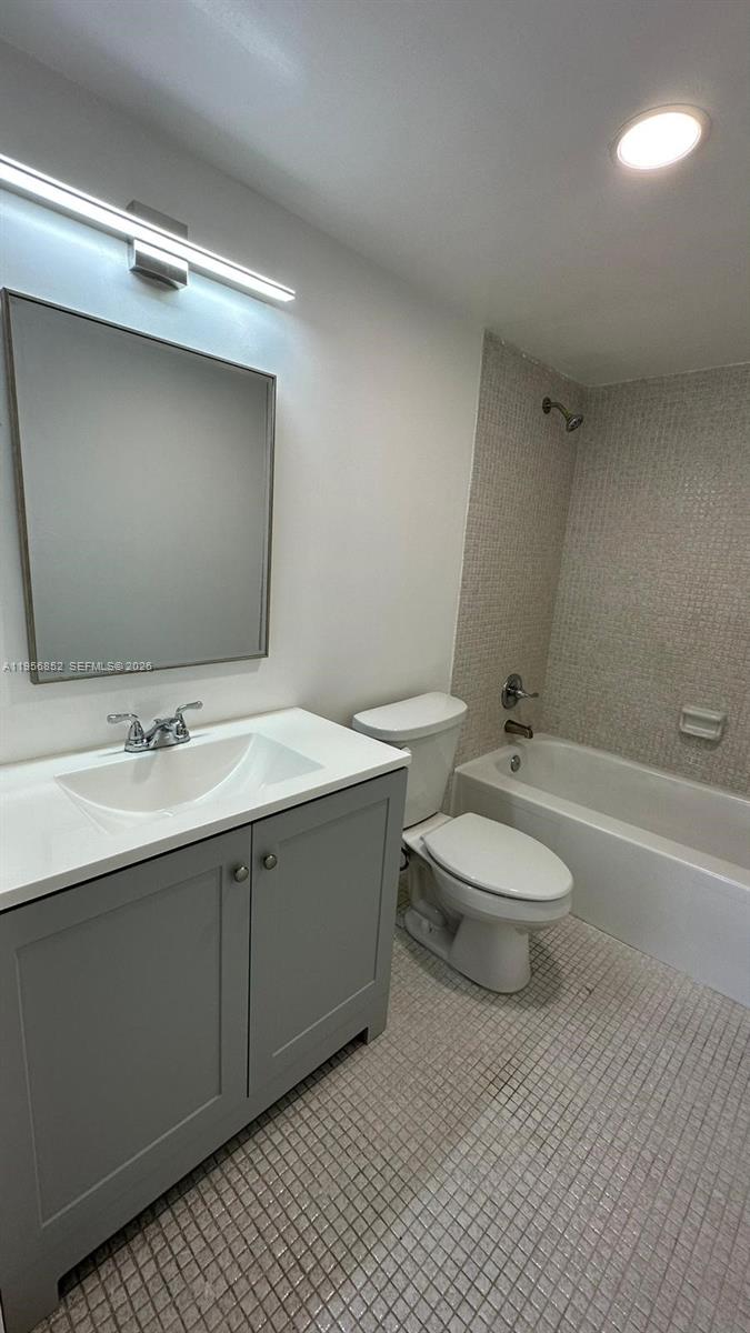 4174 Inverrary Drive, Unit 311 Lauderhill, FL 33319 - Photo 21 of 29 a bathroom with a double vanity sink and a mirror