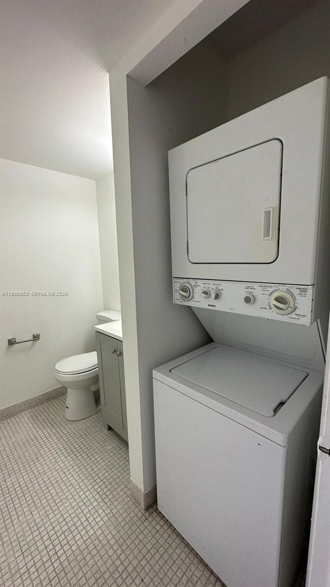 4174 Inverrary Drive, Unit 311 Lauderhill, FL 33319 - Photo 25 of 29 a utility room with dryer and washer