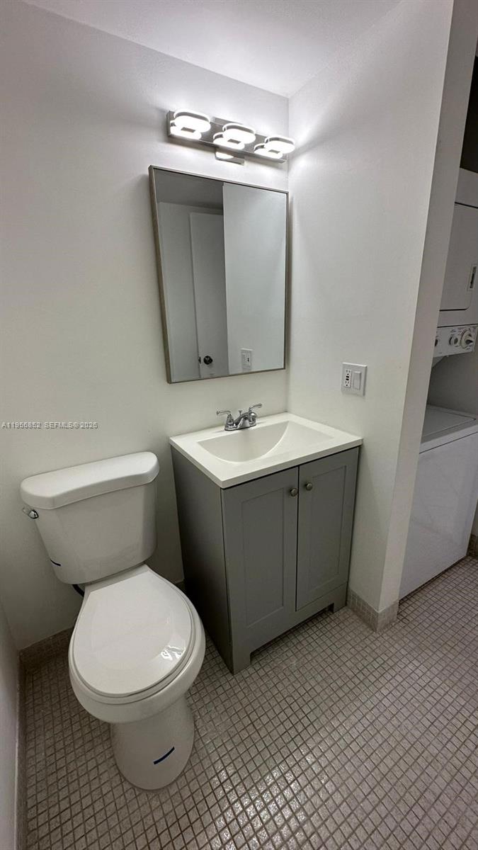 4174 Inverrary Drive, Unit 311 Lauderhill, FL 33319 - Photo 26 of 29 a bathroom with a toilet sink and mirror