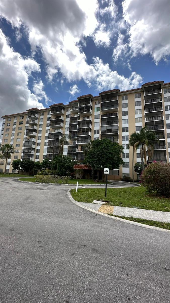 4174 Inverrary Drive, Unit 311 Lauderhill, FL 33319 - Photo 29 of 29 a view of building with a big yard