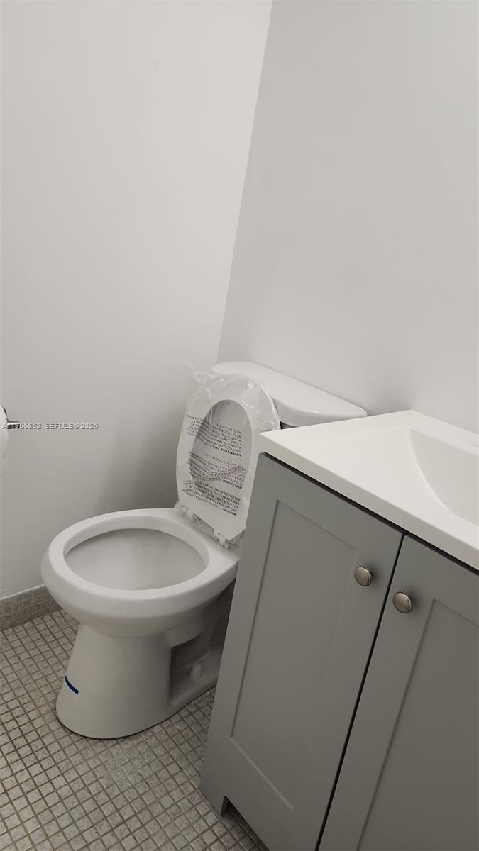 4174 Inverrary Drive, Unit 311 Lauderhill, FL 33319 - Photo 3 of 29 a white toilet sitting next to a white sink
