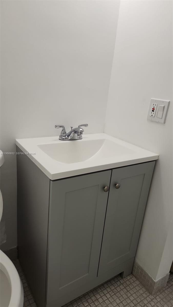 4174 Inverrary Drive, Unit 311 Lauderhill, FL 33319 - Photo 4 of 29 a bathroom with a sink toilet and vanity