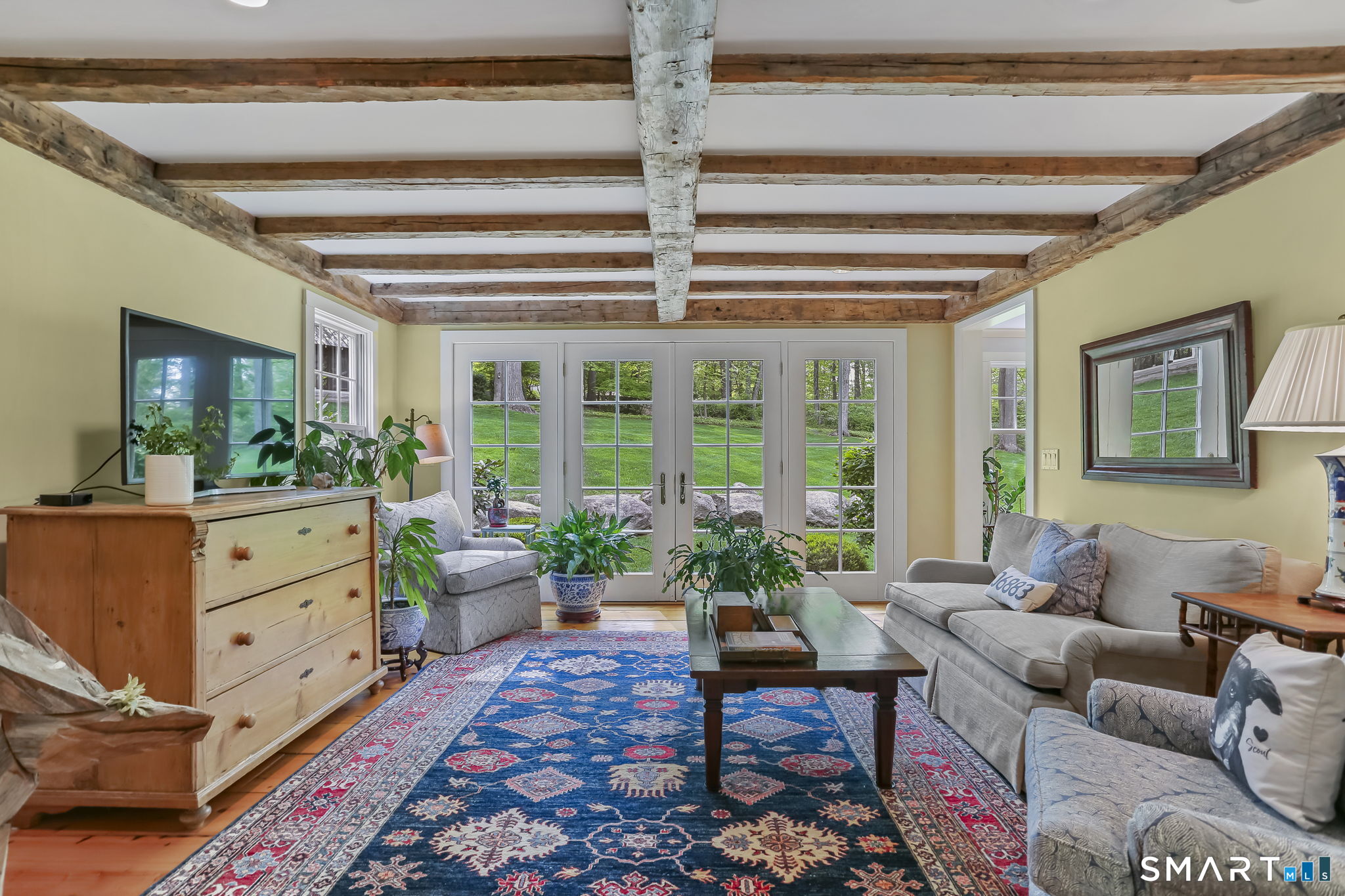 23 Old Stage Coach Road Weston, CT 06883 - Photo 15 of 37 a living room with furniture and a potted plant