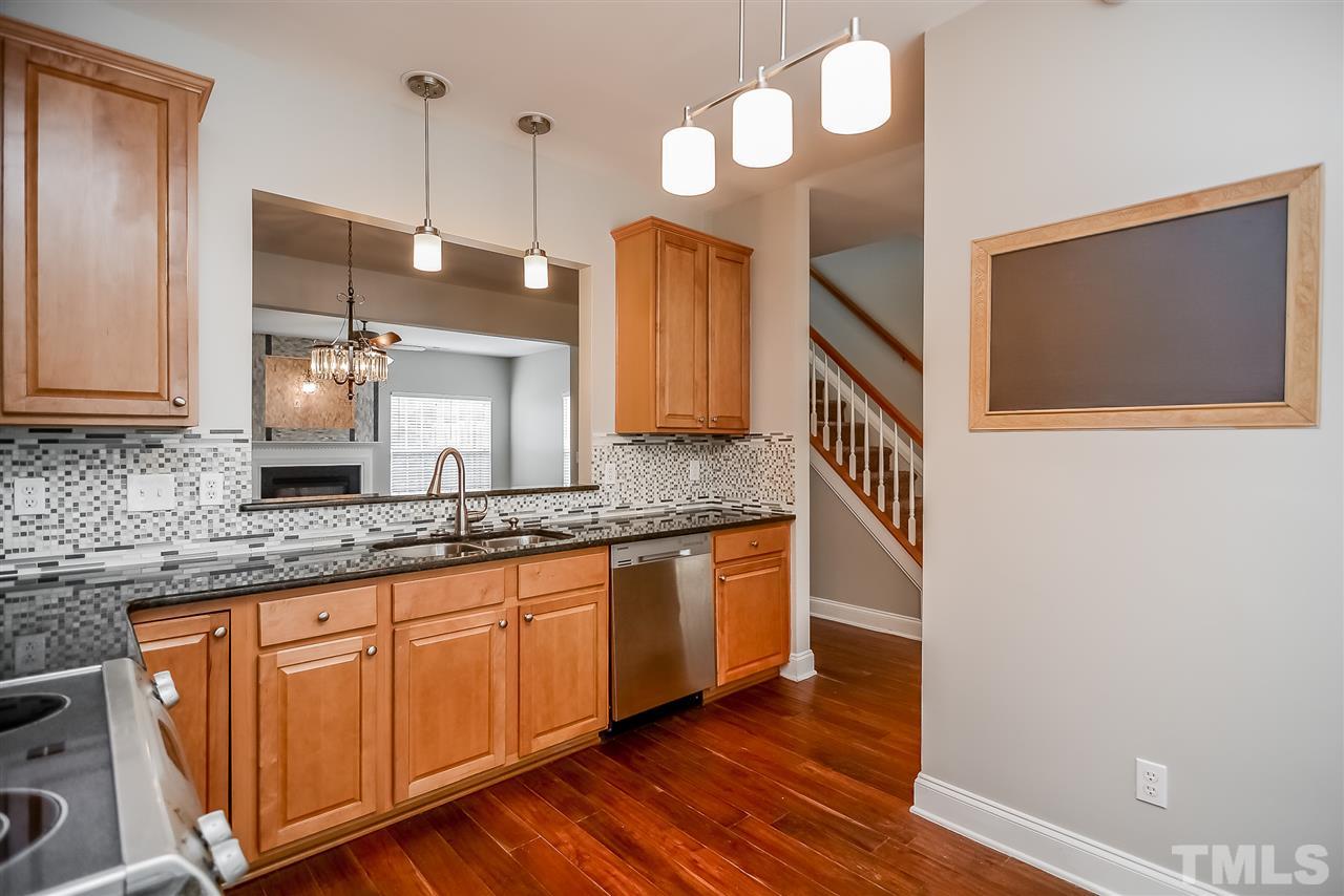 3020 Settle In Lane Raleigh, NC 27614 - Photo 2 of 25 Granite tops, tile backsplash, ss appliances, upgraded lighting, hardwood floors, raised panel cabinets