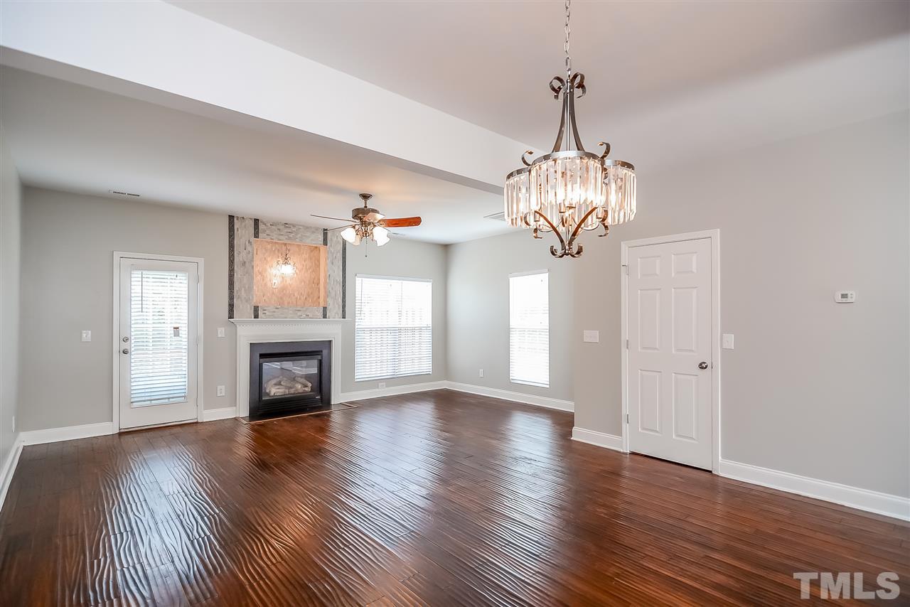 3020 Settle In Lane Raleigh, NC 27614 - Photo 4 of 25 Hardwood Floors, Tile TV Niche, Deck off Main Level overlooks Neuse River Buffer.