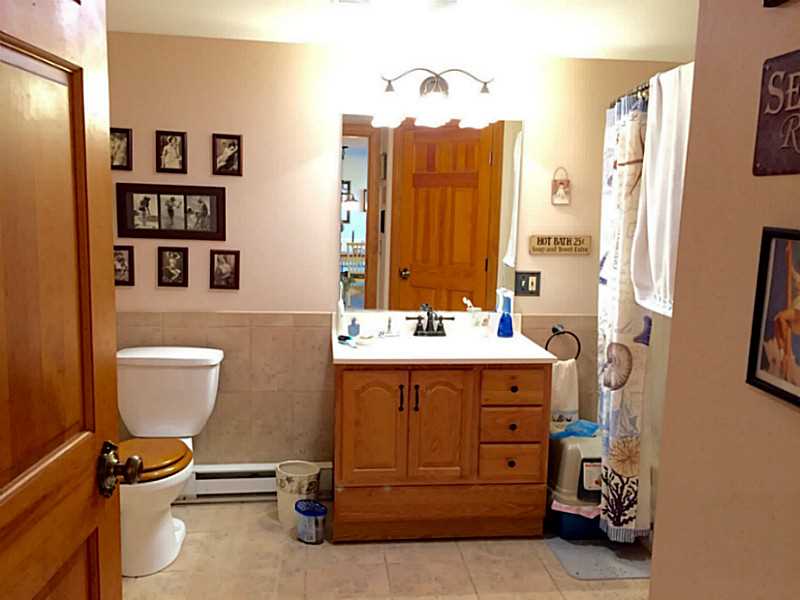 63 Mason Road Barrington, RI 02806 - Photo 13 of 22 Bathroom. Full bath features stackable laundry area.