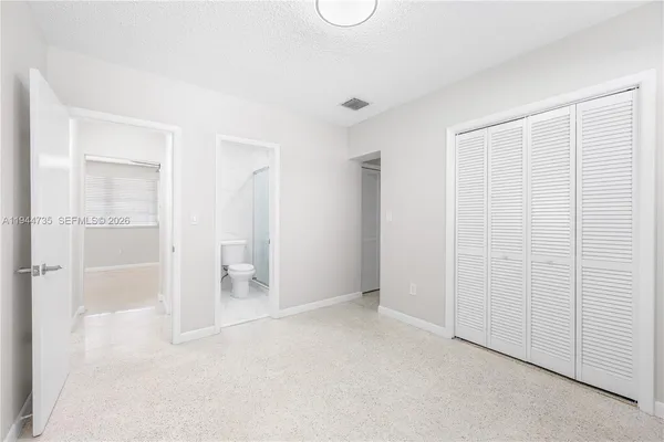 an empty room with a bathroom