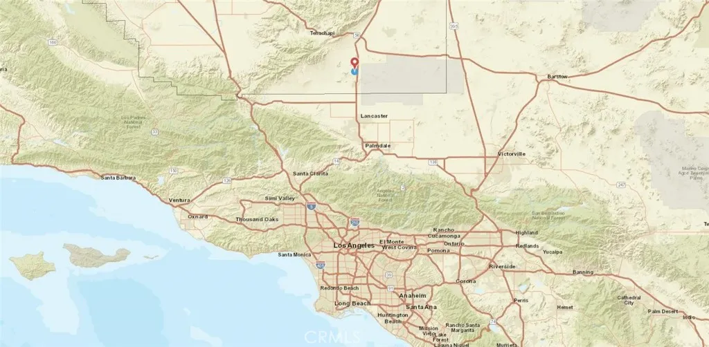 0 Clark Street Mojave, CA 93501 - Photo 5 of 9 a white bed sitting in a bathroom next to a window