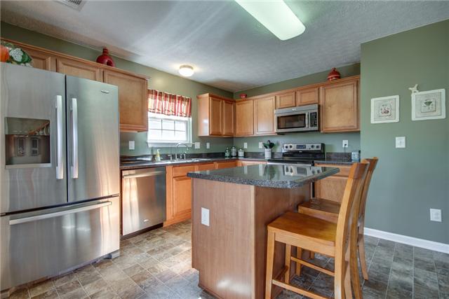 1898 Portway Road Spring Hill, TN 37174 - Photo 2 of 20 Huge kitchen with stainless appliances, island, eat in area, lots of cabinets and a door to the patio/backyard