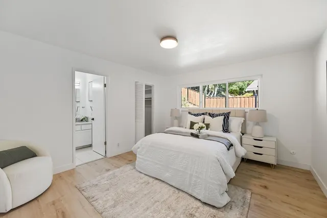 a bedroom with a bed and a couch