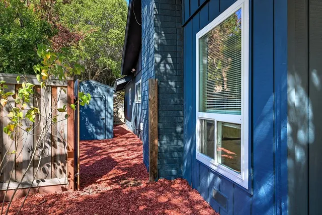 a view of a pathway of a house with backyard