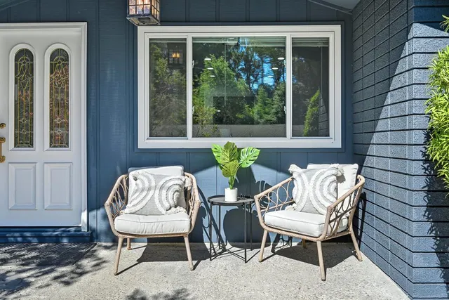 a view of a two chairs in the balcony