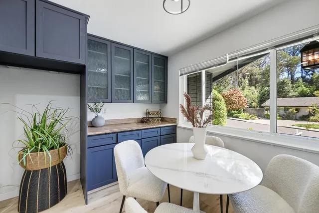 a dining room with furniture and window