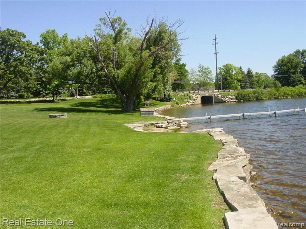 3875 East Commerce Road Commerce Township, MI 48382 - Photo 17 of 29 327' of ledge rock seawall