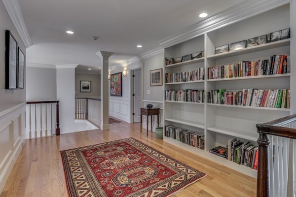32 Whipple Road Lexington, MA 02420 - Photo 17 of 30 a living room with lots of furniture and a book shelf