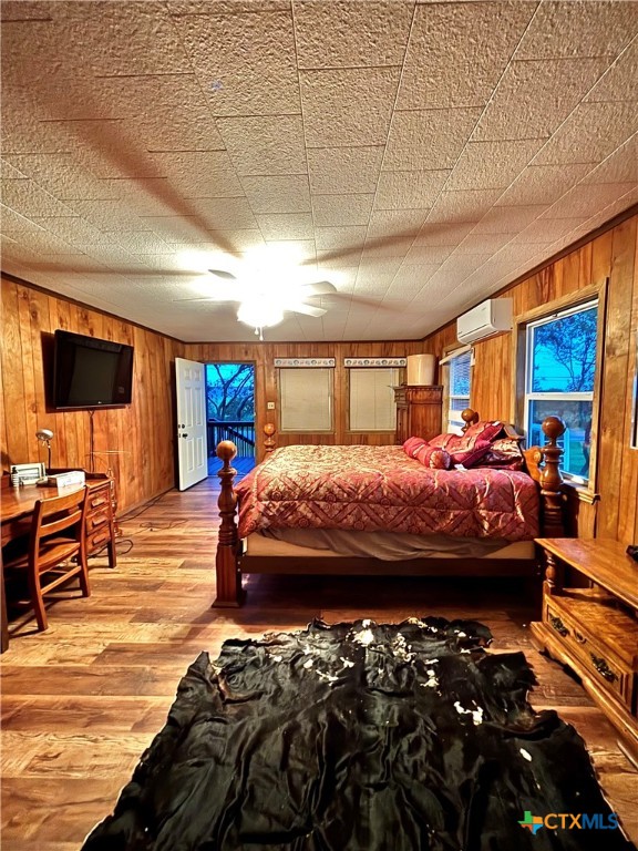 1008 Adams Avenue Port O'Connor, TX 77982 - Photo 13 of 43 a bedroom with a bed and wooden floor